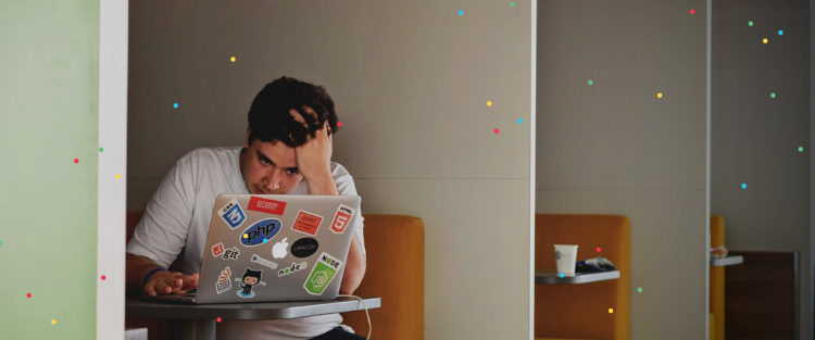 Frustrated man looking at laptop