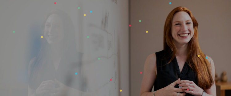 A woman standing in front of a whiteboard