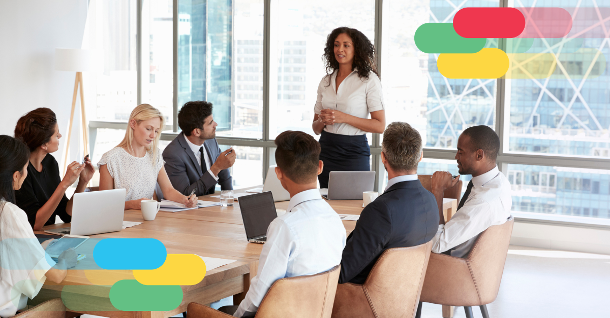 How to run aHow to run a meeting for four kinds of thinking: a woman leads a boardroom meeting while eight colleagues listen around the table.
